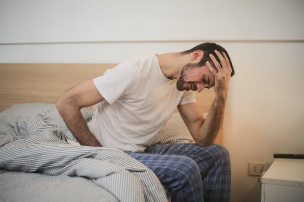 A man getting out of bed